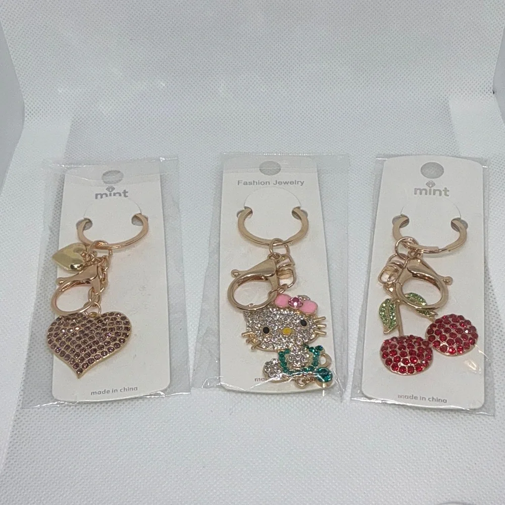Keychain Trio Mint Charm with Gold and Red Accents.